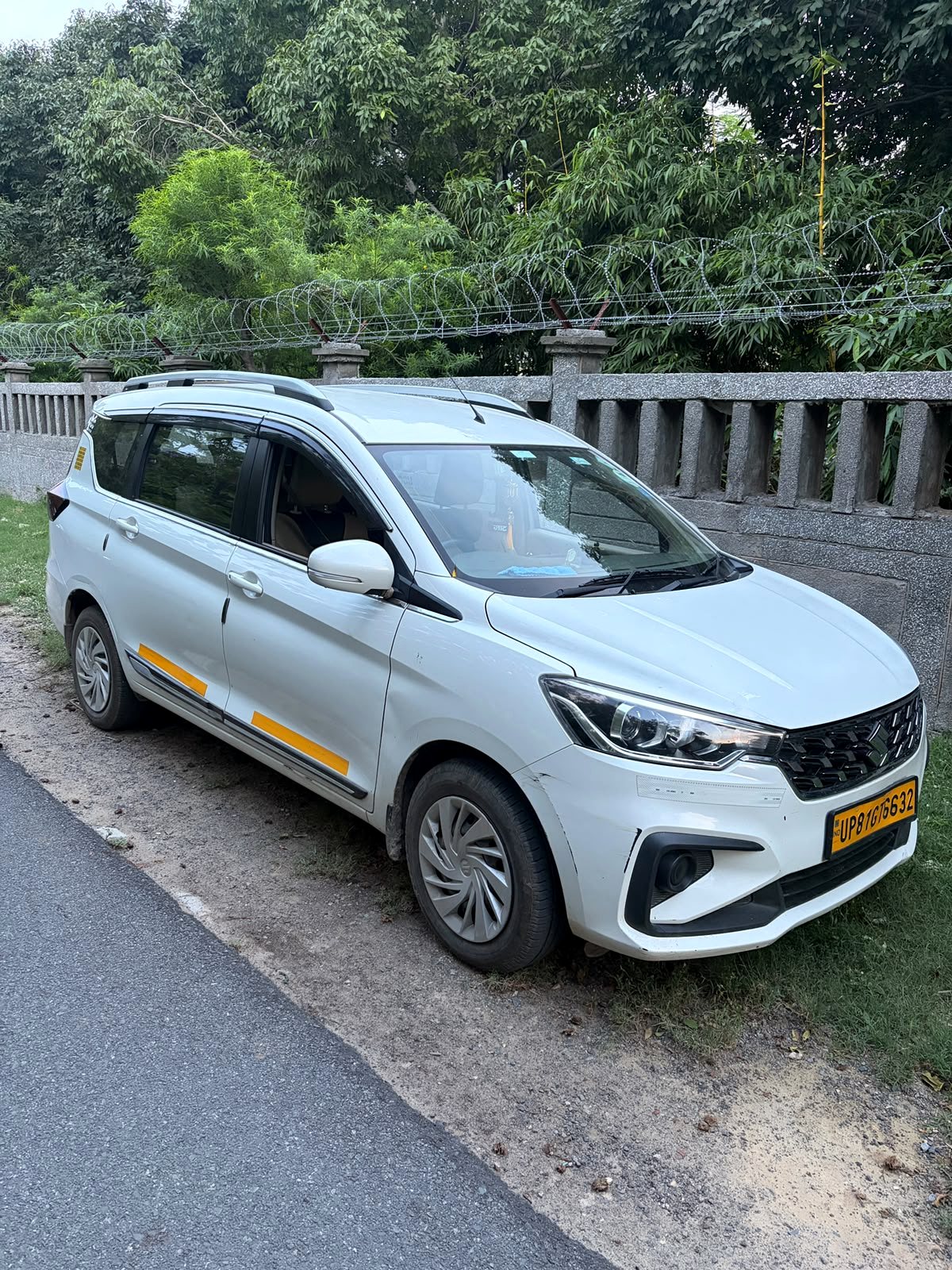 White 2026 Maruti Suzuki Ertiga operated by Raj Travels NCR