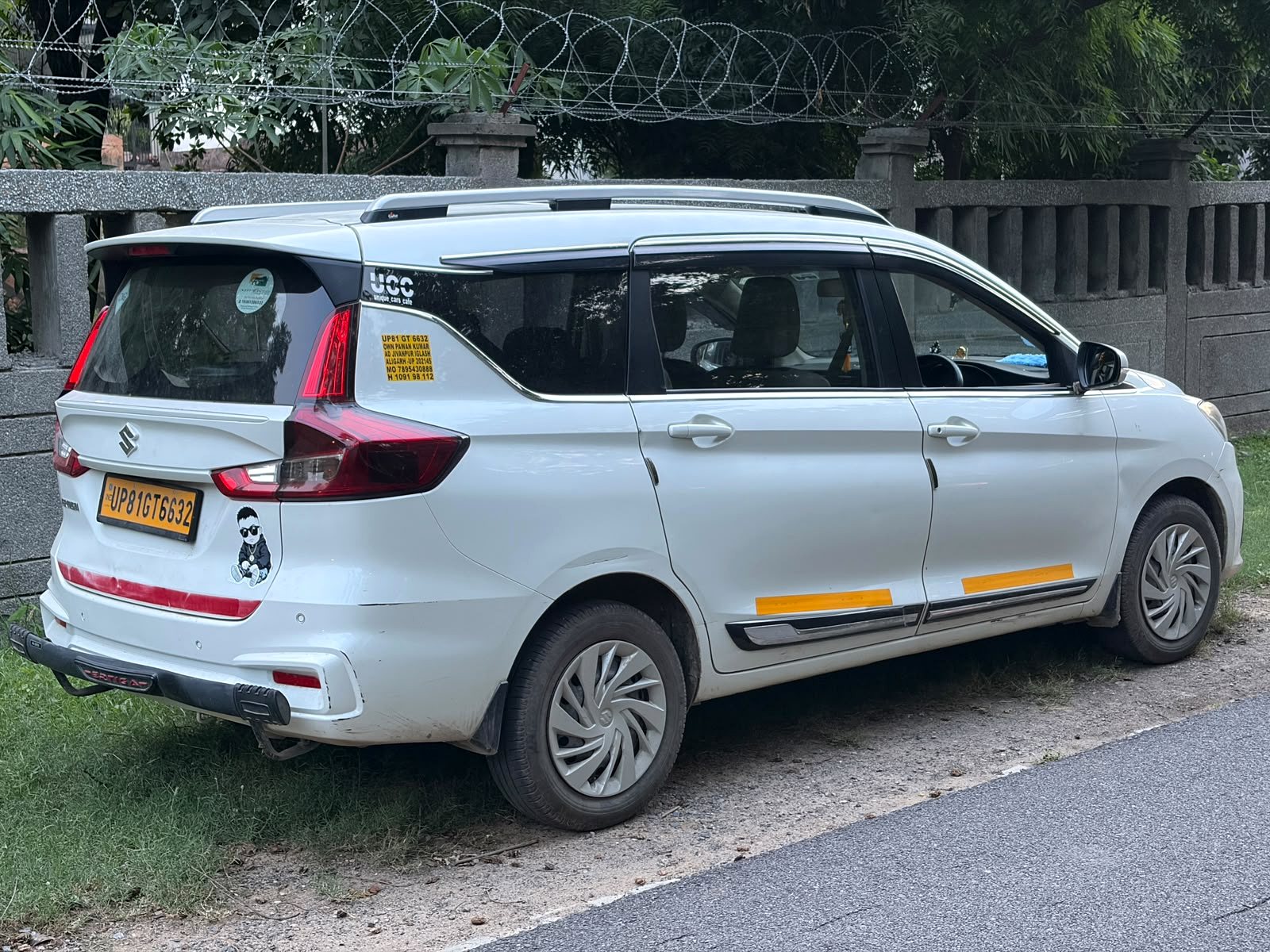 Side and rear view of Raj Travels NCR Ertiga